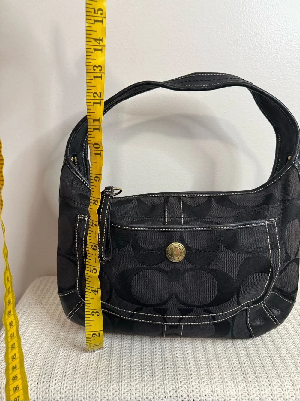 Coach Ergo Signature Jacquard Hobo bag featuring a black-on-black
